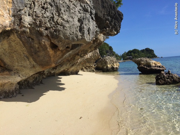 the white sand and rock formations of the Aga Islet